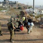 Israel soldiers beat journalists to transfer real